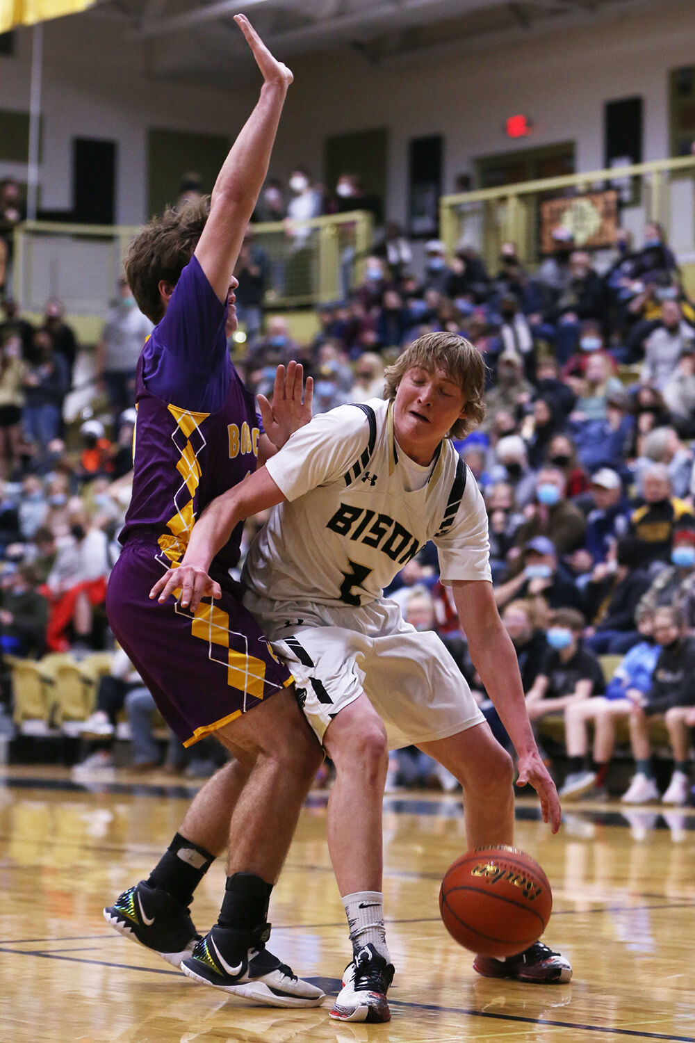 Coy Johnson pushes through a Newcastle defender before shooting